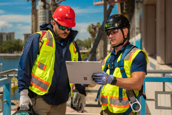 Consultant reviewing workplace inspection with employee