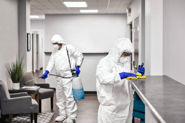 Office lobby being disinfected by professionals