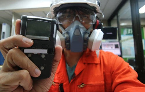 Man inspecting for chemical exposure